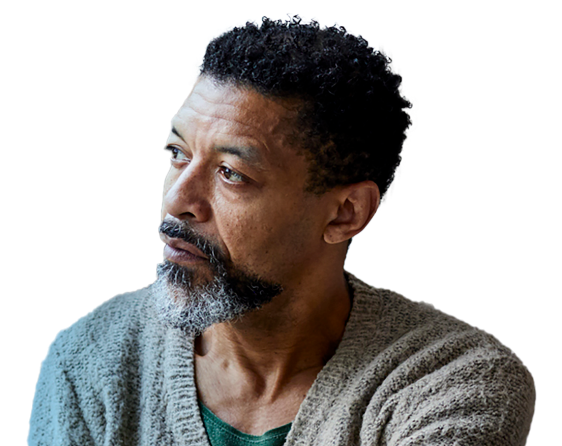 man looking to his right with a neutral expression